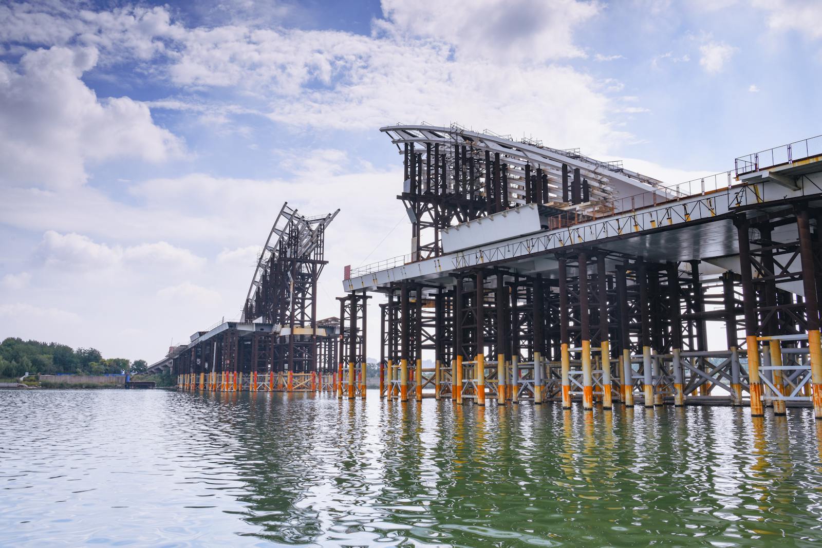 Steel framework of a bridge structure spanning a river